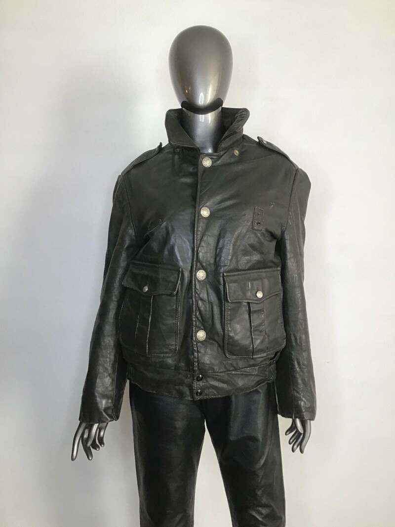 Buy Police leather jacket fastened on zipper and  buttons have two pockets outside and one zipper pocket inside men size medium olive color.